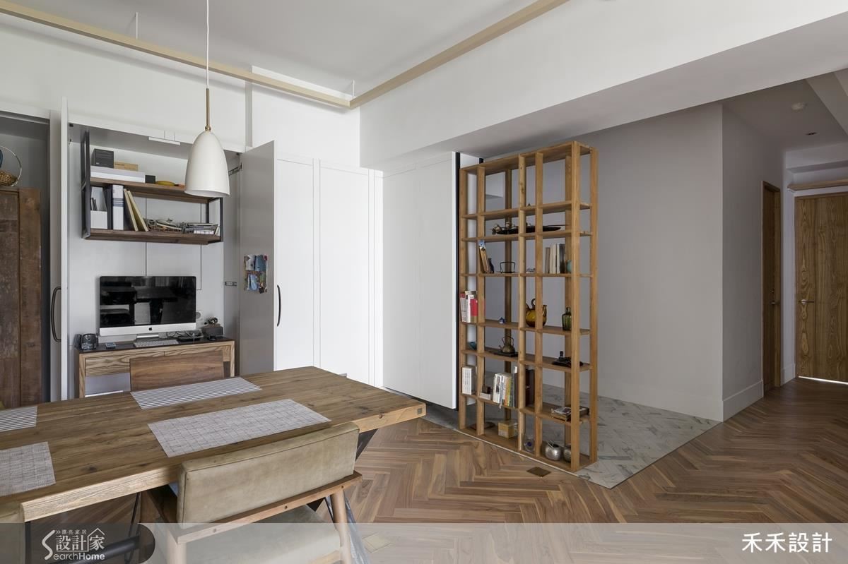 不同材質劃分出玄關區，以懸掛藝術品的端景區隔私領域和公領域空間。