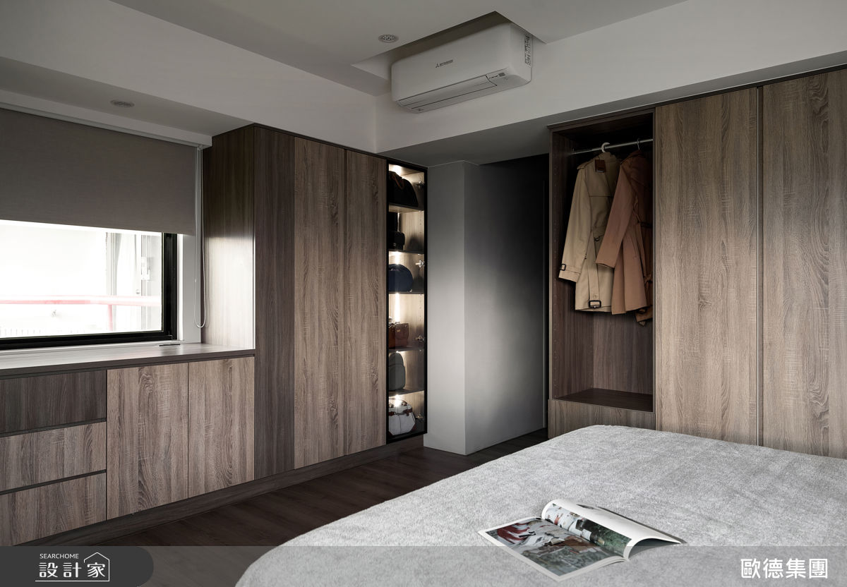 女主人房以高低櫃體劃分梳妝與睡眠區，擴充包包展示位置，保持採光與整潔。