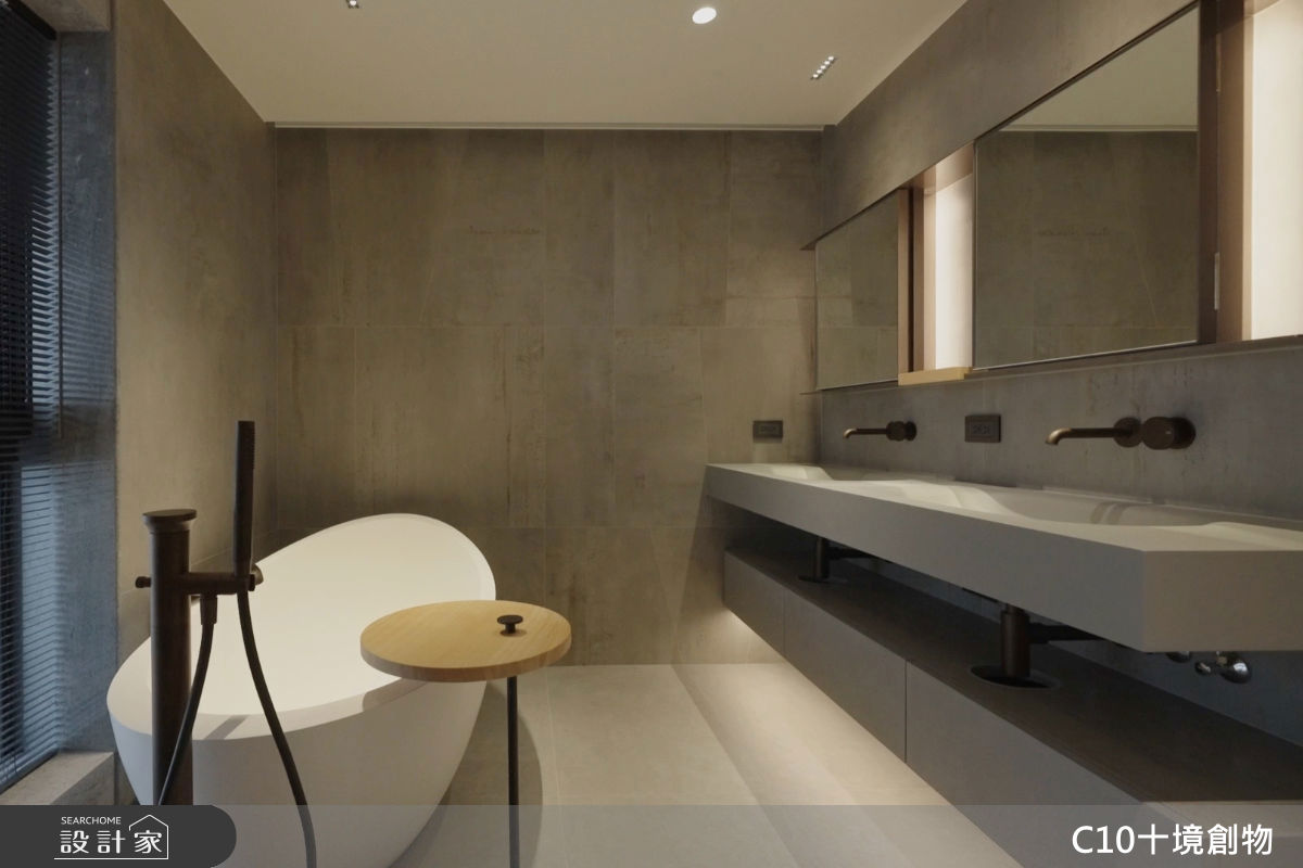 主臥浴採較粗獷的工業風，與臥室的溫潤氛圍形成反差。