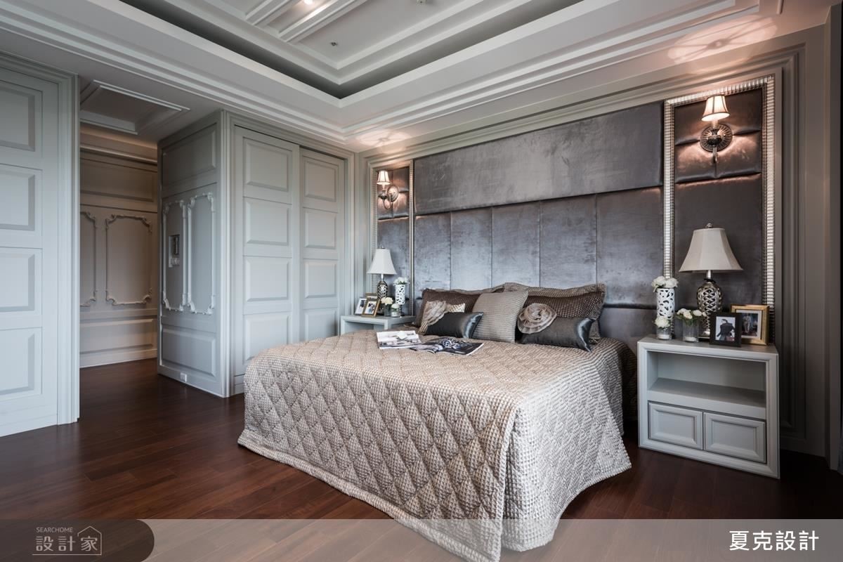 主臥房以清爽米白色打底，在優雅線板的造型勾勒下，成就空間的典雅姿態。
