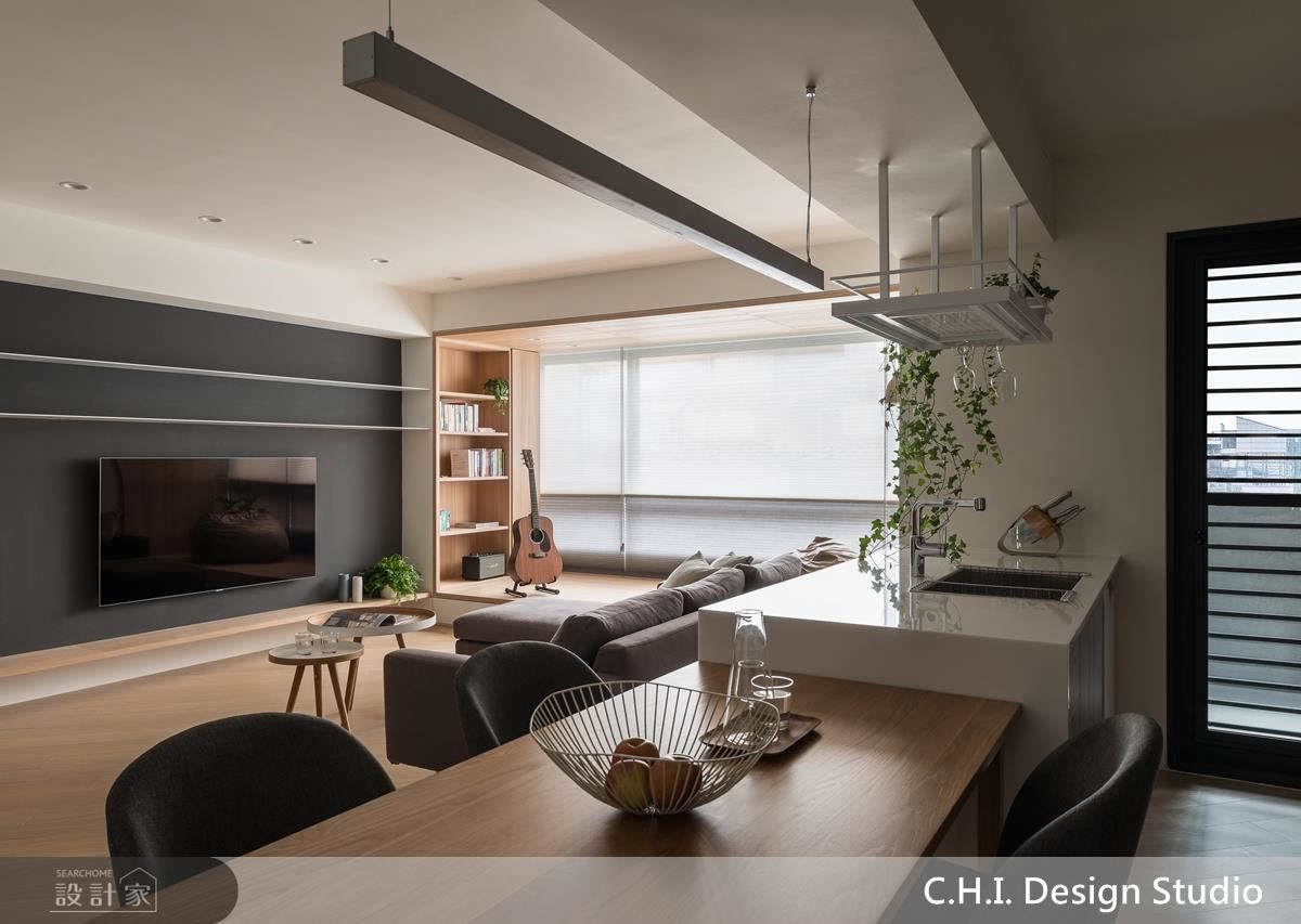 廚房吧檯以植栽吊架設計，為都市生活增添自然綠意。